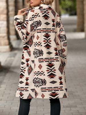 Longline teddy coat with Aztec print in cream, black, and rust, featuring pockets.