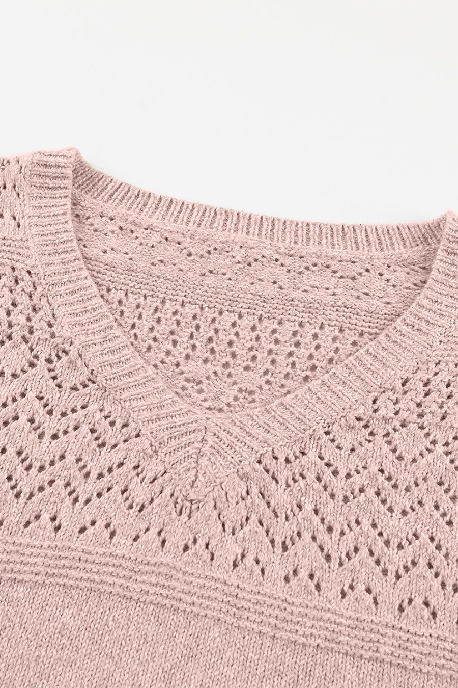 Dusty pink perforated knit V-neck pullover sweater with openwork detail.