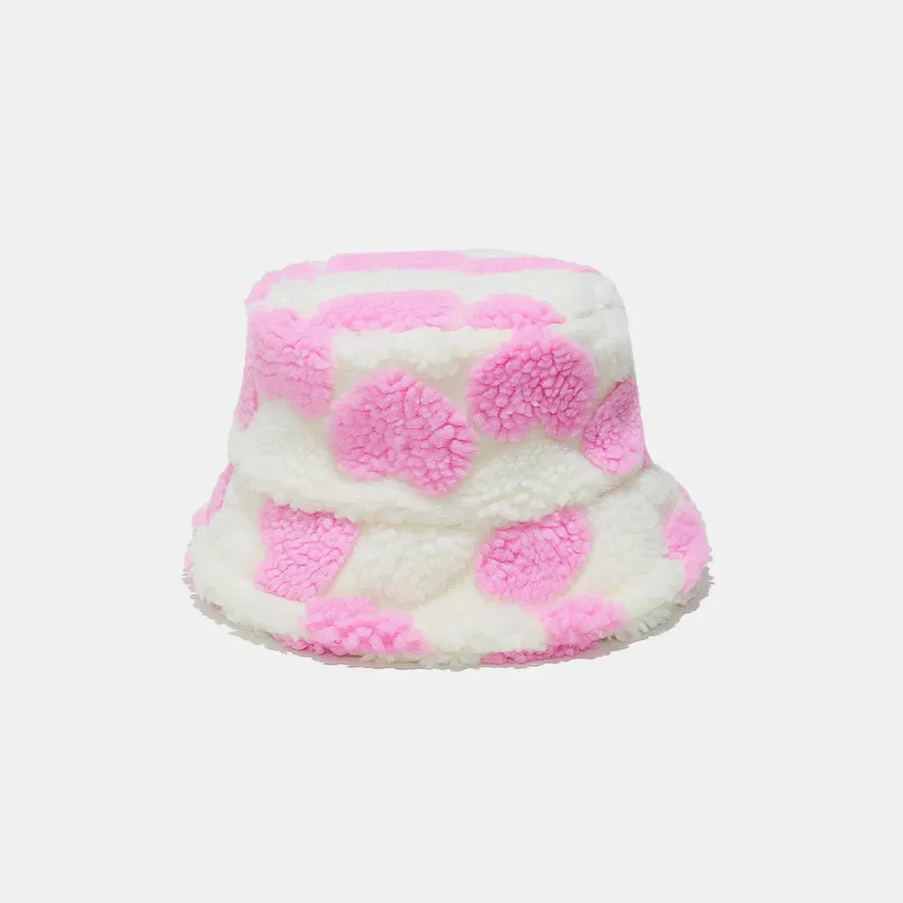 Pink polka dot fuzzy sherpa bucket hat with a cozy texture