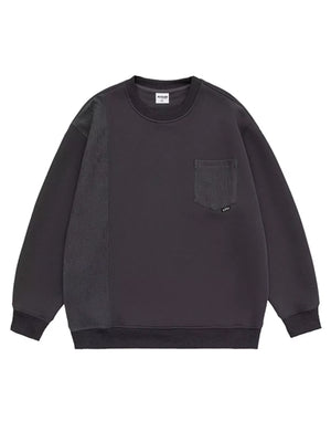 Dark gray sweatshirt with crewneck, pocket, and textured sleeve panel.