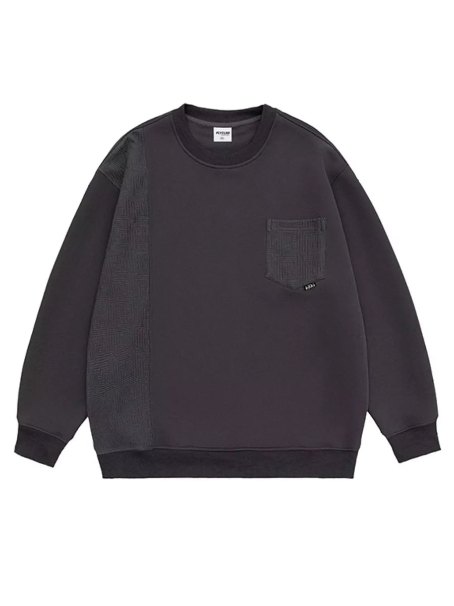 Dark gray sweatshirt with crewneck, pocket, and textured sleeve panel.