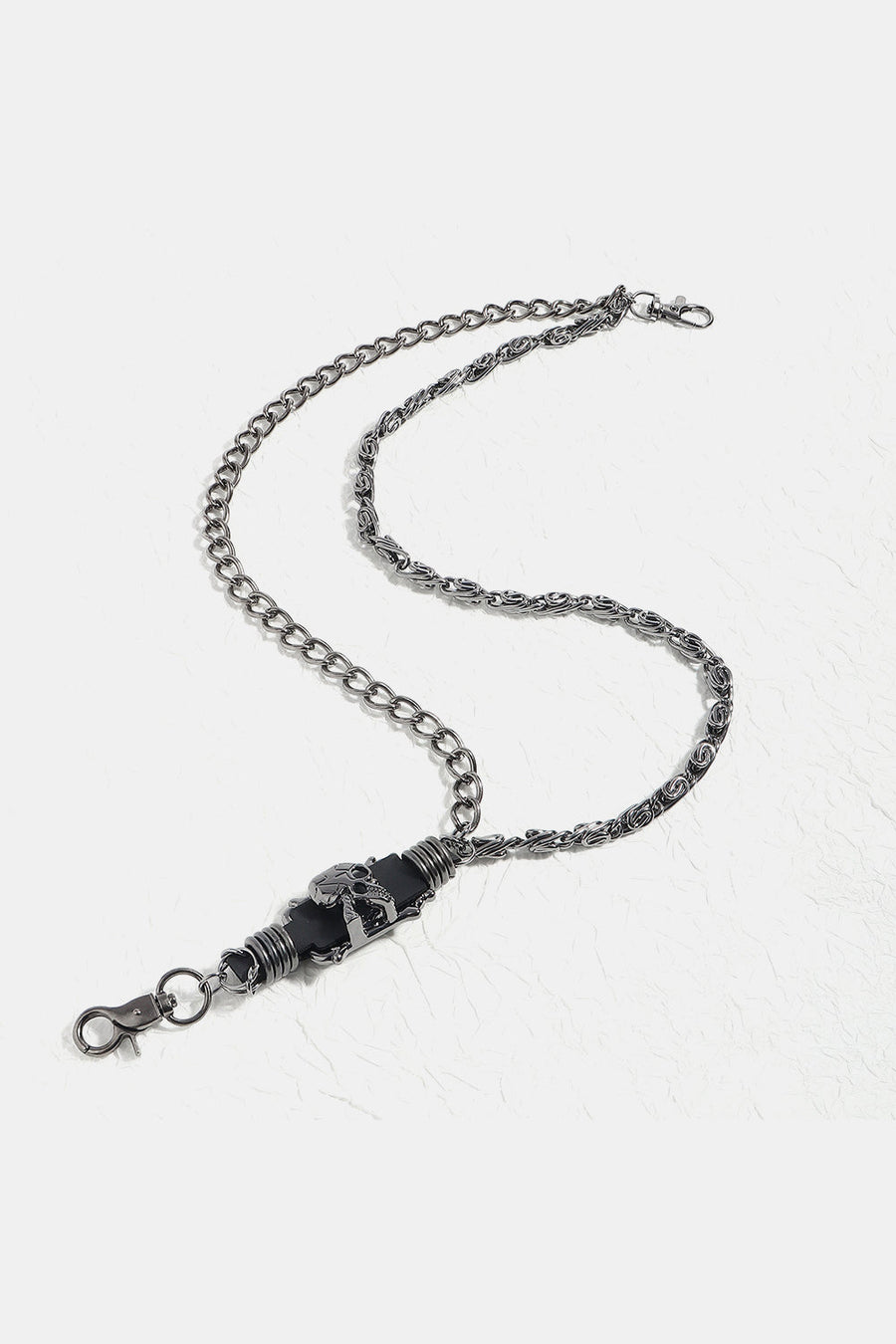 Gothic chain belt in black alloy with skull detail and lobster clasp.