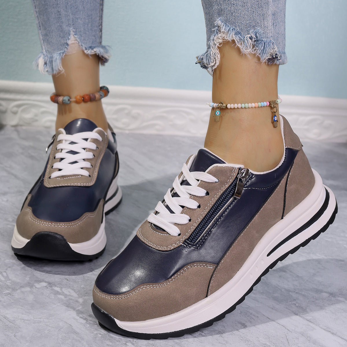 Zipper detail lace up sneakers in navy and champagne with chunky sole.