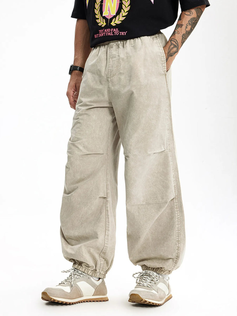 Khaki relaxed fit cargo pants with elastic waistband and cuffs, quick-dry cotton.
