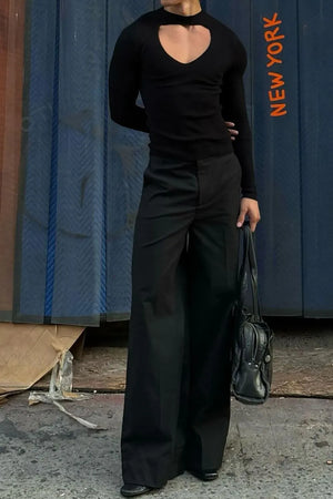 Black ribbed knit long sleeve top with heart cutout neckline