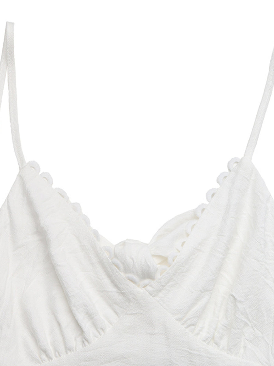 White lace tiered maxi dress with scalloped trim and a knot detail.
