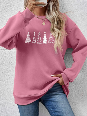 Blush pink oversized sweatshirt with a festive tree line graphic and crew neck.