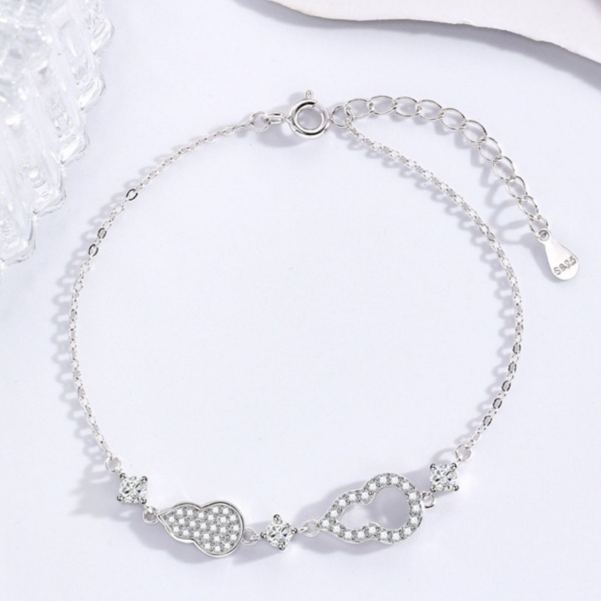 Silver adjustable bracelet with pave zircon gourd charm and infinity charm