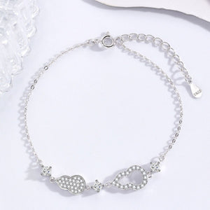 Silver adjustable bracelet with pave zircon gourd charm and infinity charm