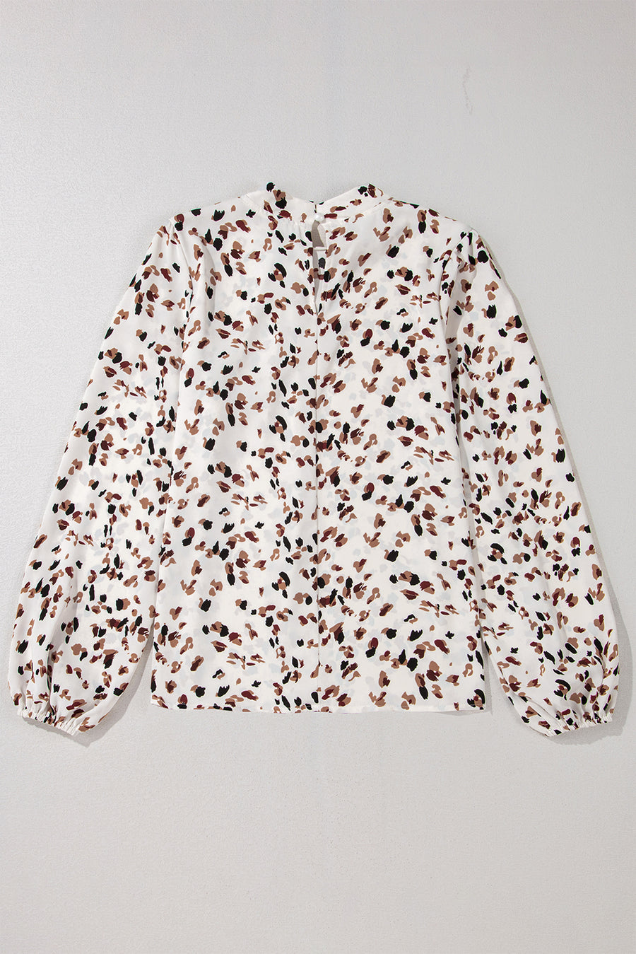 White abstract print blouse with high neck and balloon sleeves