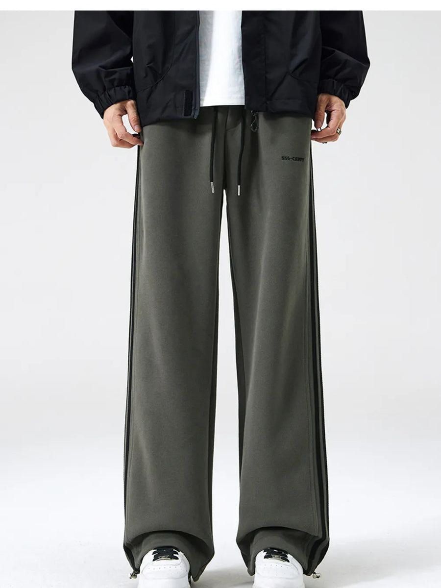 Men's army green sweatpants with black side stripes and drawstring waist.