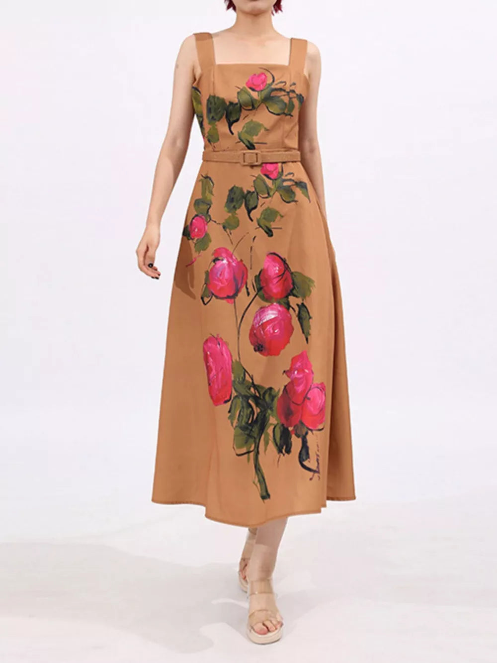 Midi dress with floral print, square neckline, sleeveless, belted waist, and brown color.