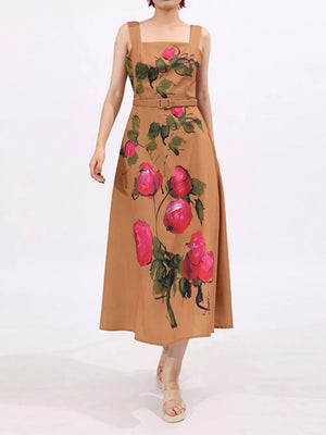 Midi dress with floral print, square neckline, sleeveless, belted waist, and brown color.