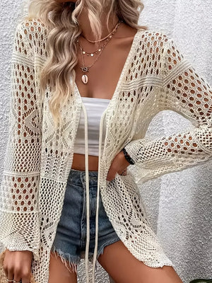 Cream crochet open knit long sleeve duster with tie front and bell sleeves.