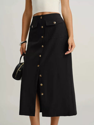 Black midi skirt with button front, flap pockets, and a front slit.