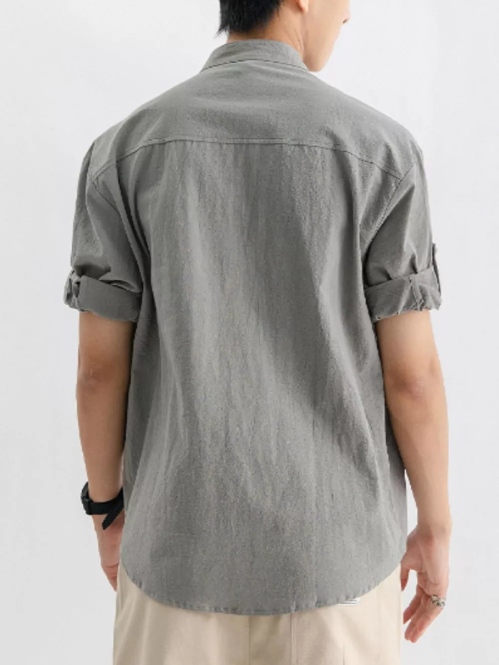 Men's gray relaxed fit button-up shirt with rolled short sleeves and a pocket detail.