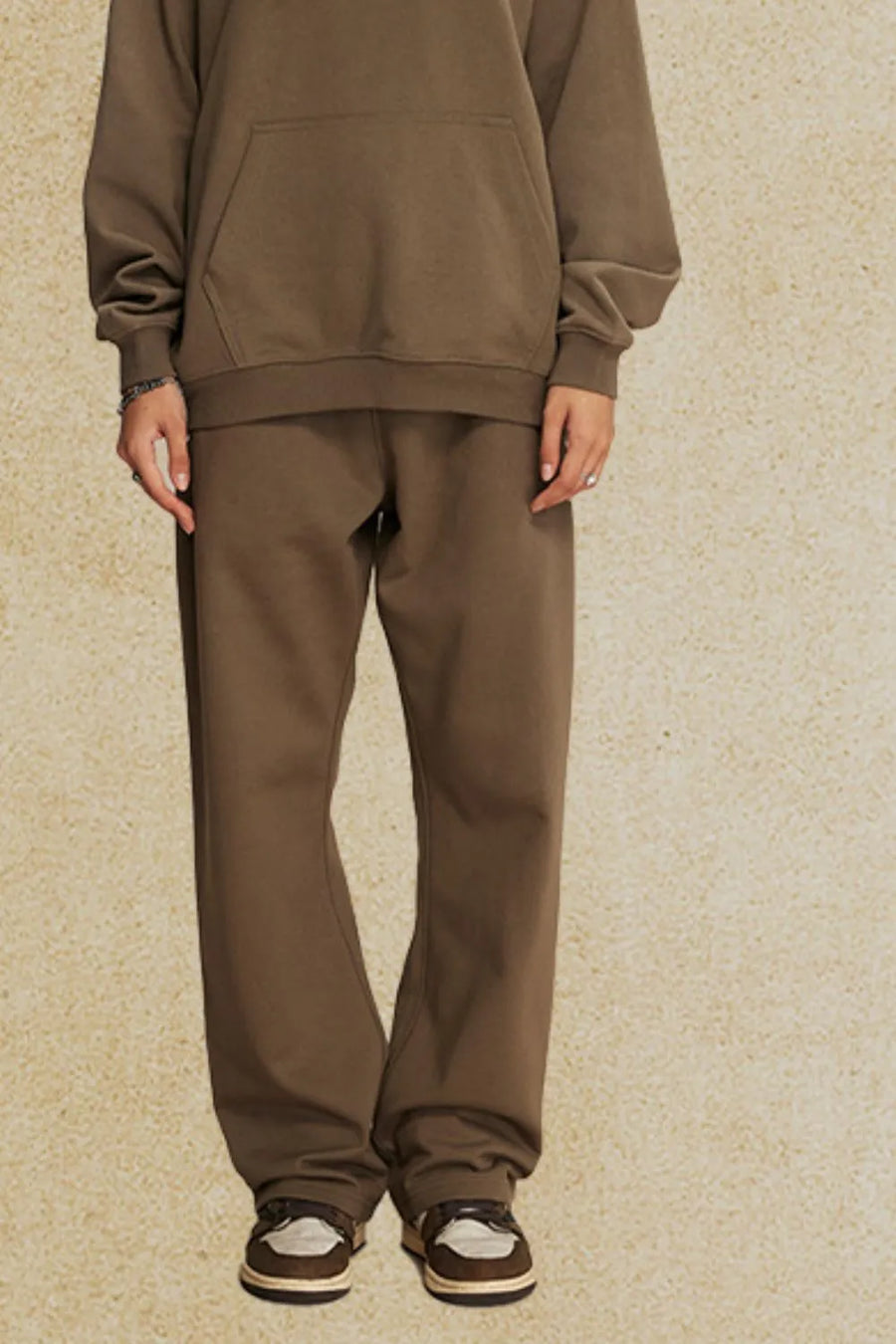 Relaxed fit lounge trousers in olive brown, with a straight leg and elastic waistband.