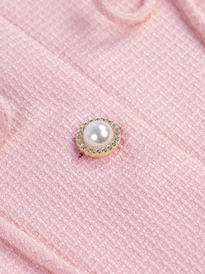 Pink knit cardigan with pearl button detail