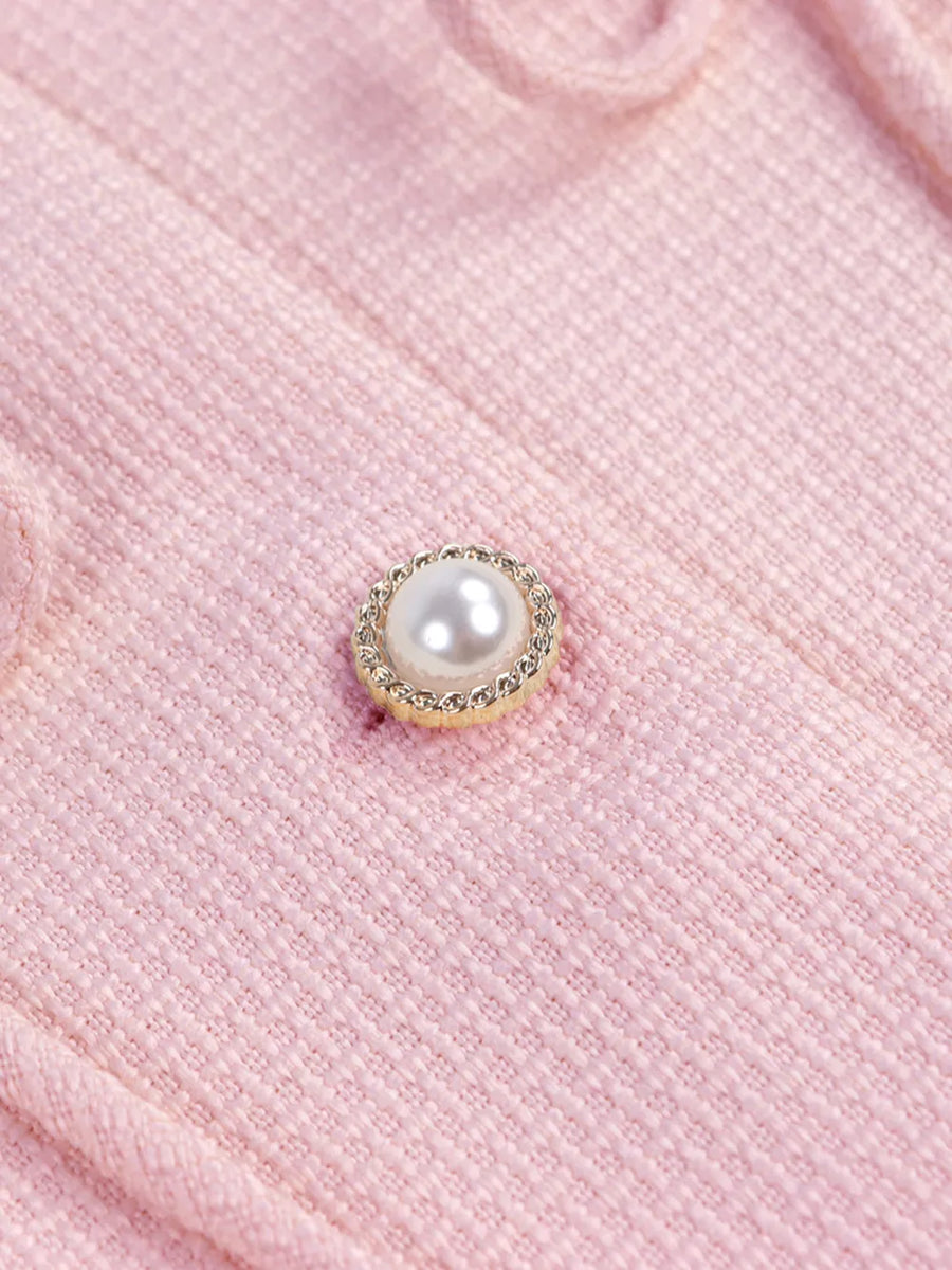 Pink knit cardigan with pearl button detail