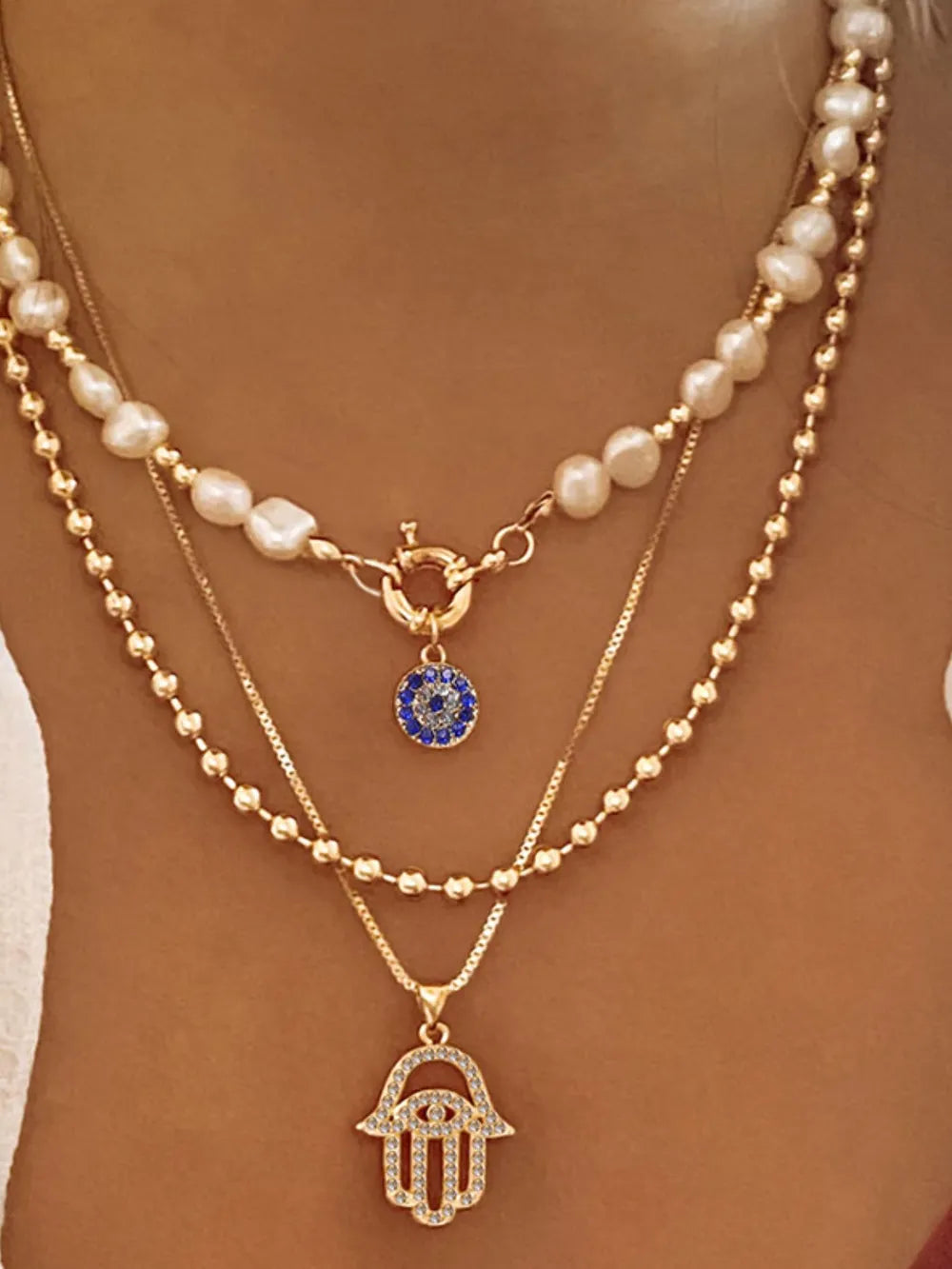 necklace in gold featuring layered design and layered fit