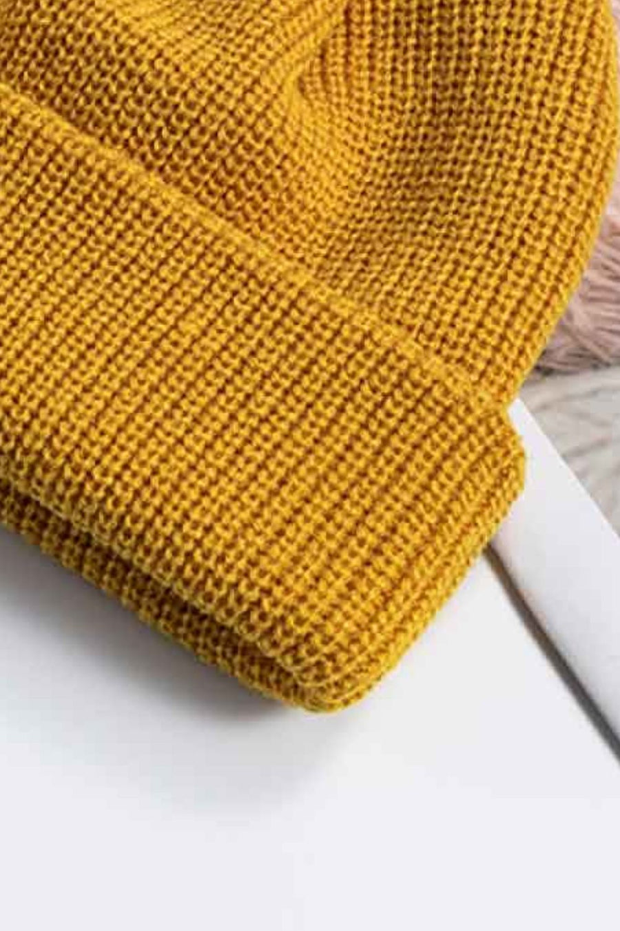 Yellow ribbed knit beanie with a turn-up cuff