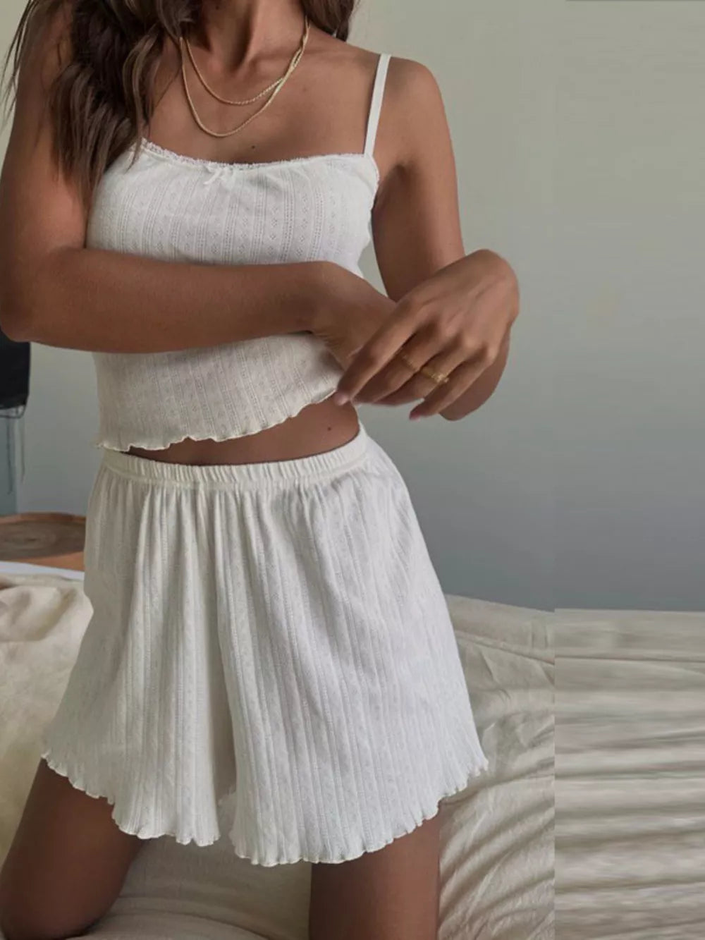 White ribbed cami and shorts set with lace trim and lettuce hem.