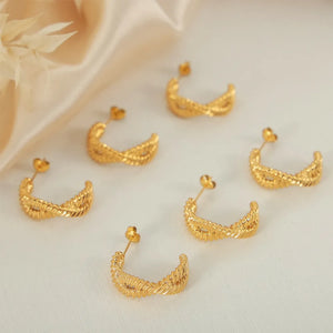 Gold vermeil braided hoop stud earrings with a chic, casual design.