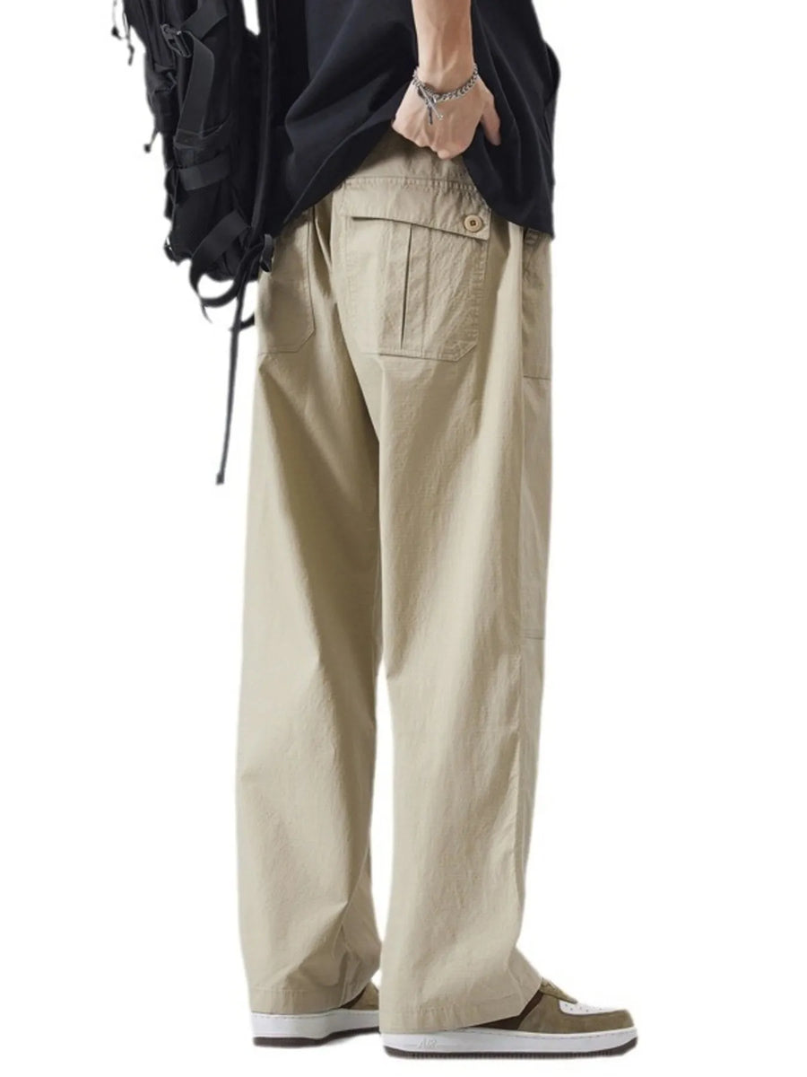 Khaki relaxed fit cargo pants with back pocket detail and drawstring waist.
