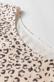 Knot detail leopard print tank top in cream and black with a ribbed neckline.