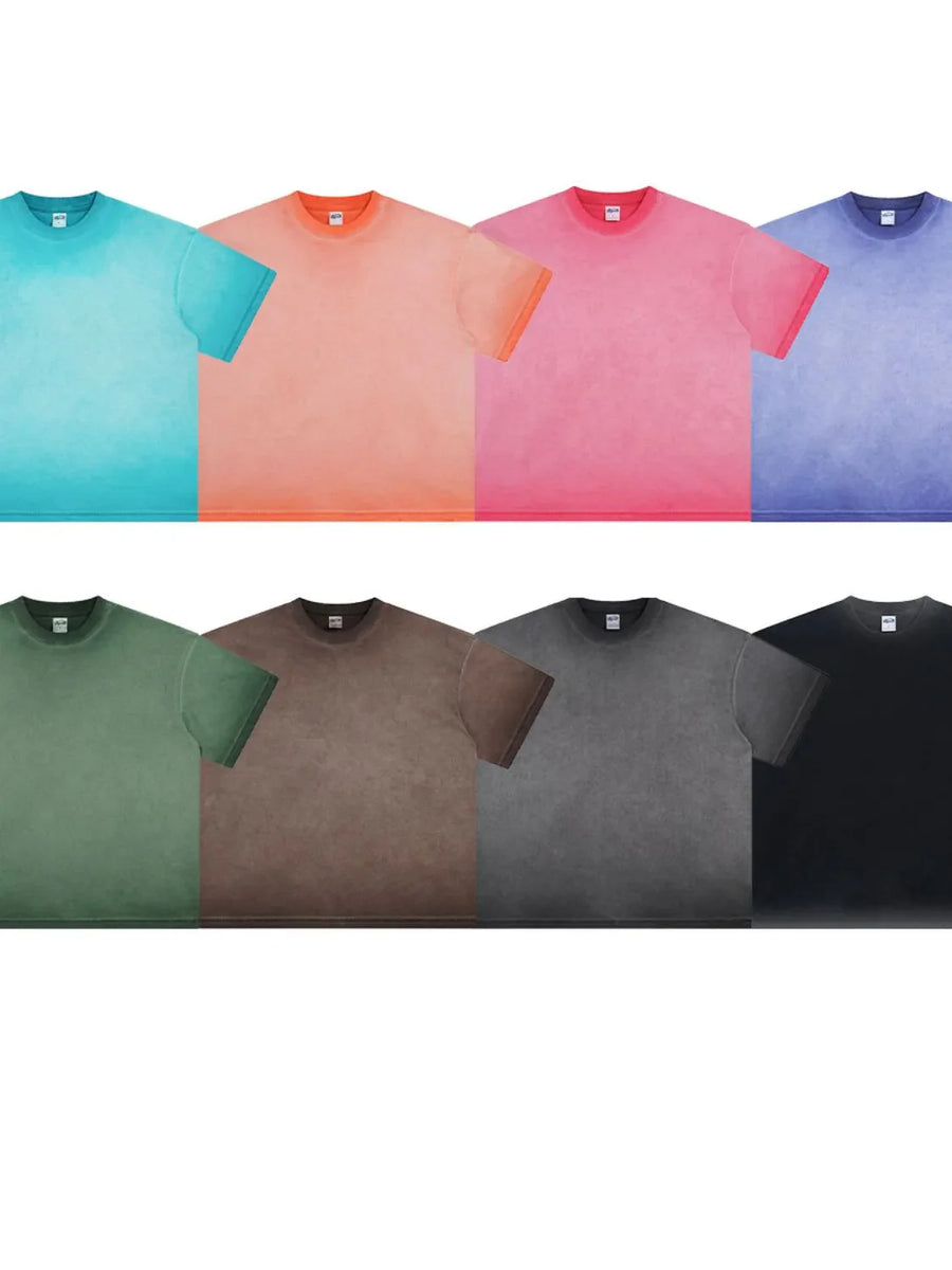 Pigment-dyed oversized tee in black, dark gray, coffee brown, moss, light indigo, hot pink, pastel blue, and burnt coral.