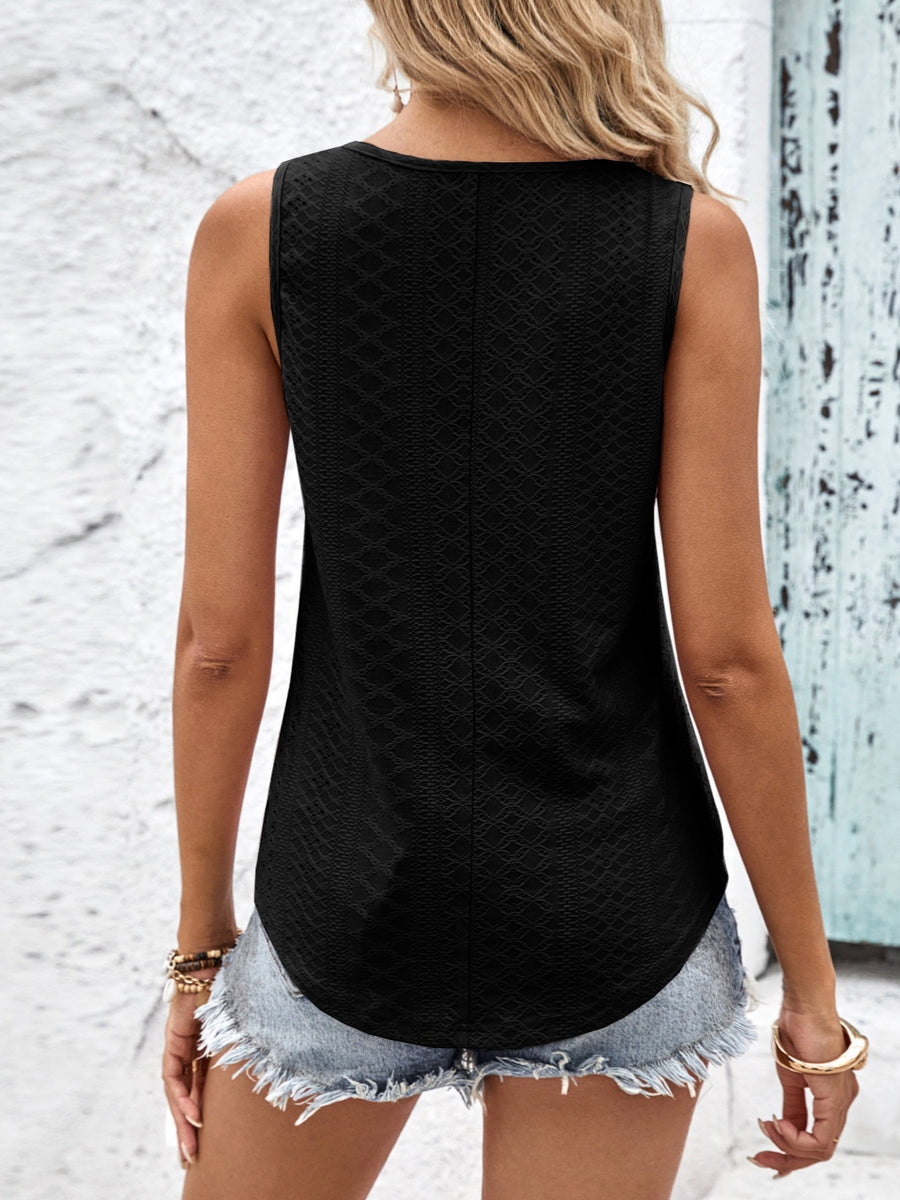 Black eyelet tank top with a textured pattern and curved hem.