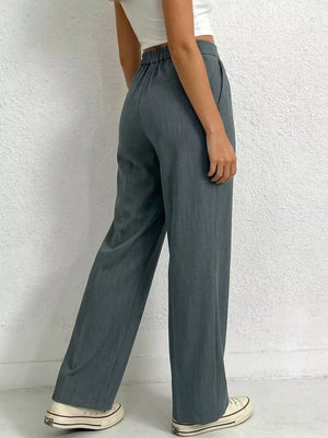 Chic high-waisted pleated maternity pants in charcoal grey with a relaxed fit.