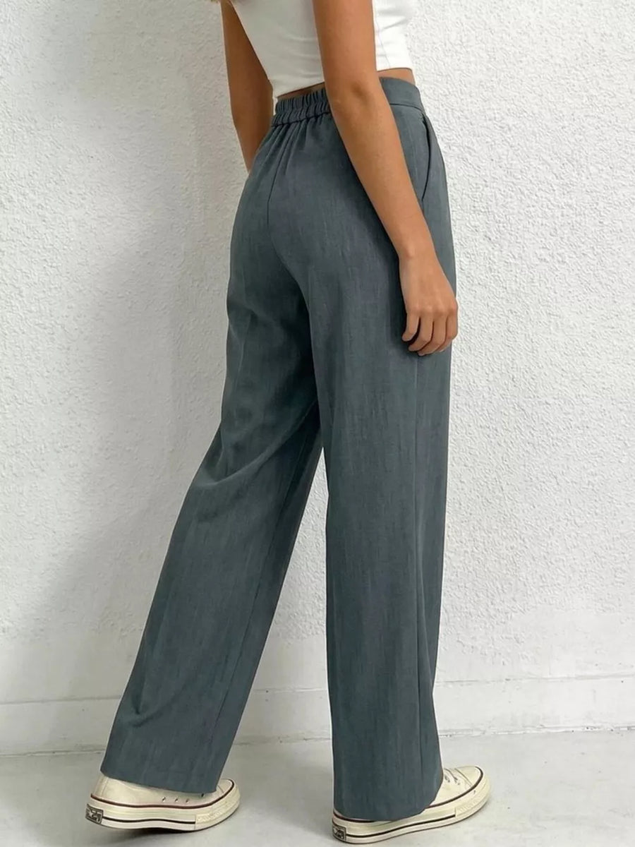 Chic high-waisted pleated maternity pants in charcoal grey with a relaxed fit.