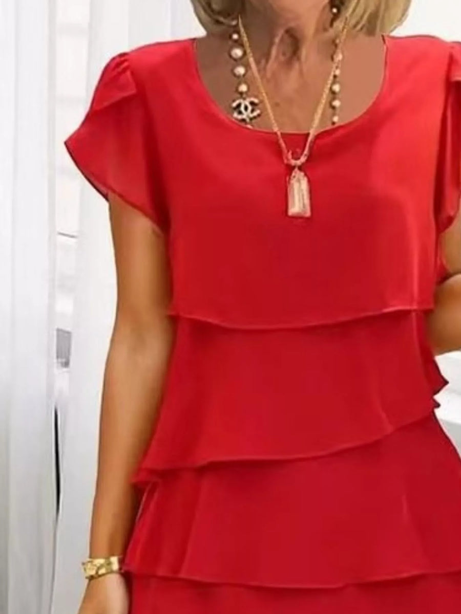 Scarlet ruffled tiered petal sleeve dress with a round neckline and layered skirt.