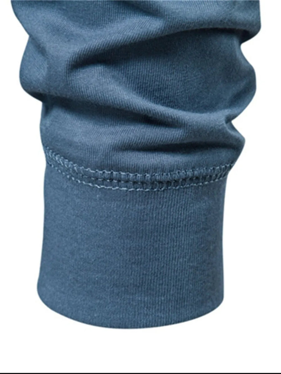 Henley knit long sleeve tee in Peacock Blue with ruched sleeve detail and contrast stitching.