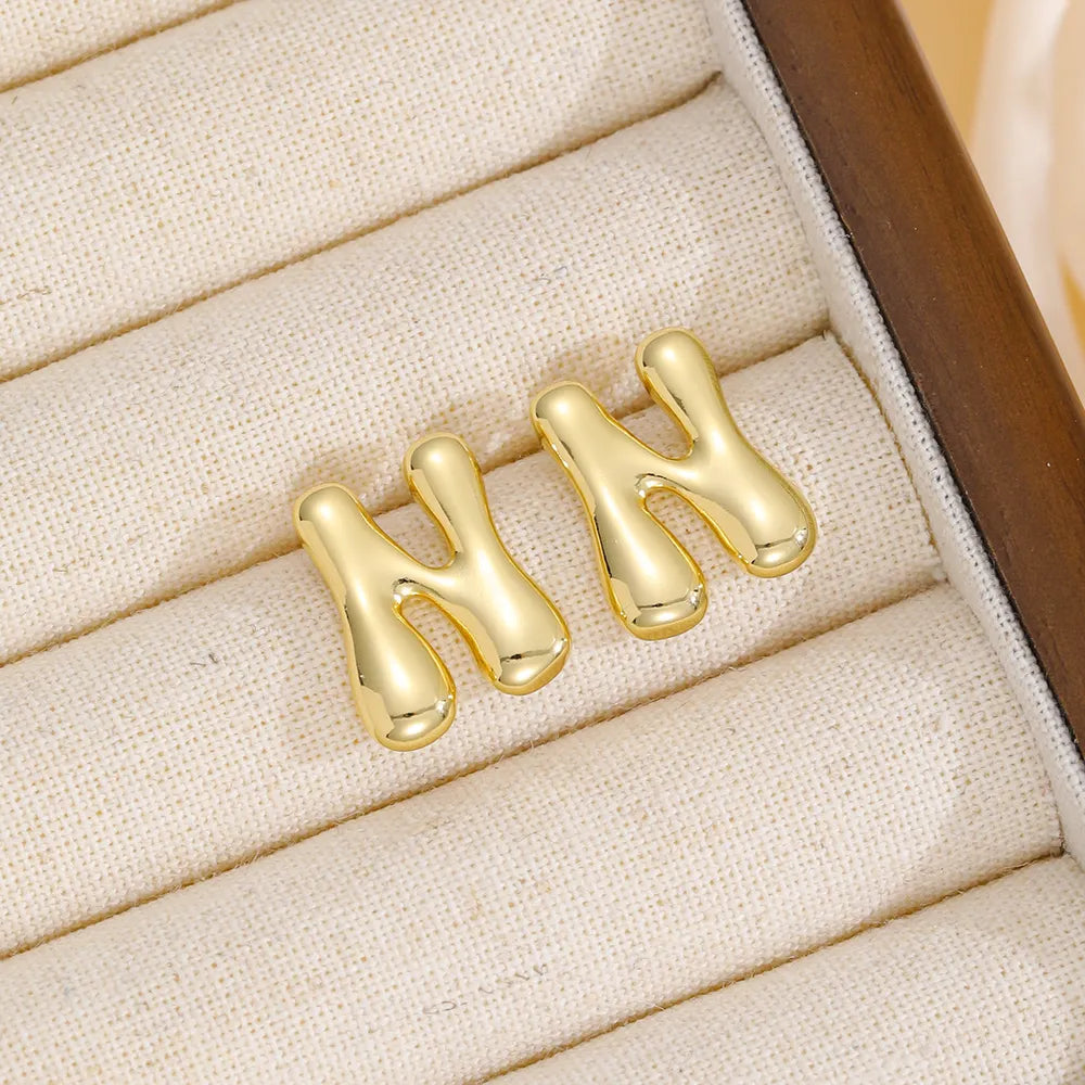 Alphabetical sculpted stud earrings in gold, Style N, with bubble design