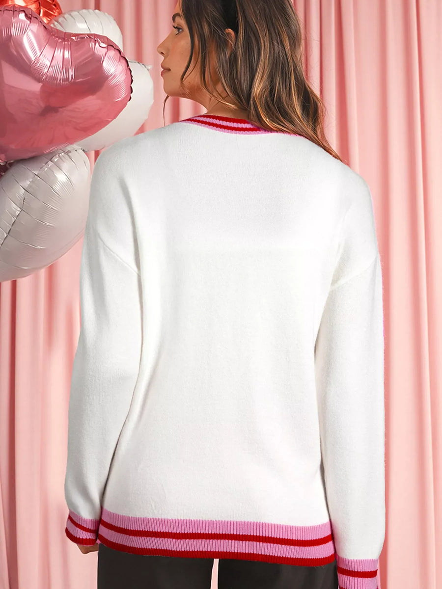 White round-neck sweater with drop shoulders and striped ribbed trim at neckline and hem.