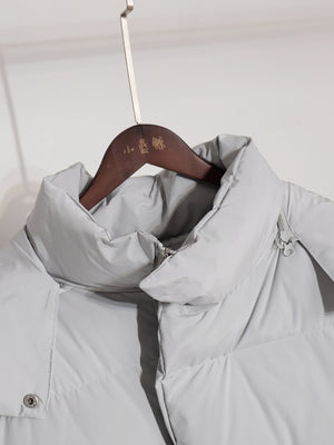 Light gray puffer jacket with high collar and zipper