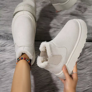 Beige suede round toe platform ankle boots with faux fur lining.
