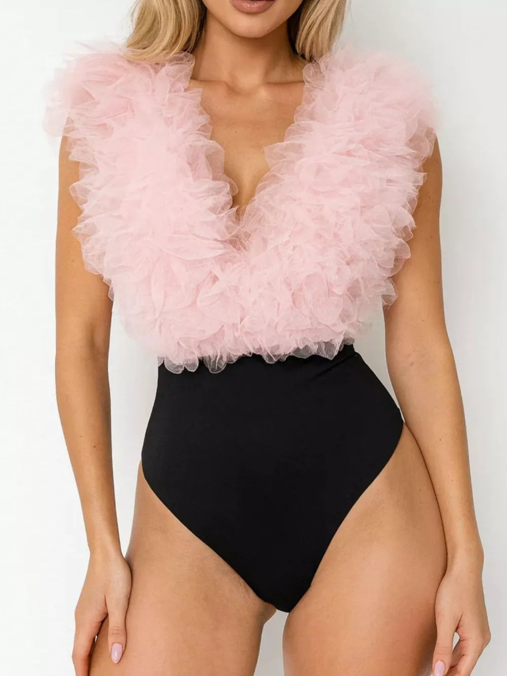 Pink ruffled V-neck bodysuit with black bottom