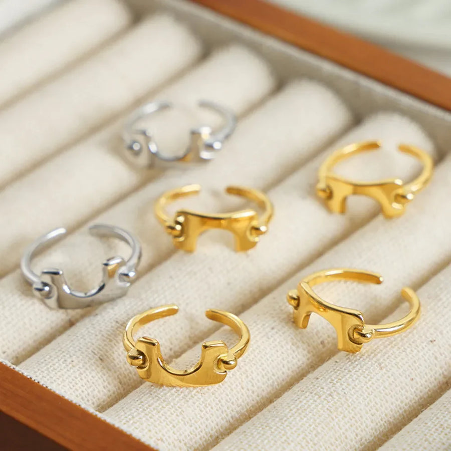 Sculptural gold open-ended ring with asymmetric detail, 18K gold-plated