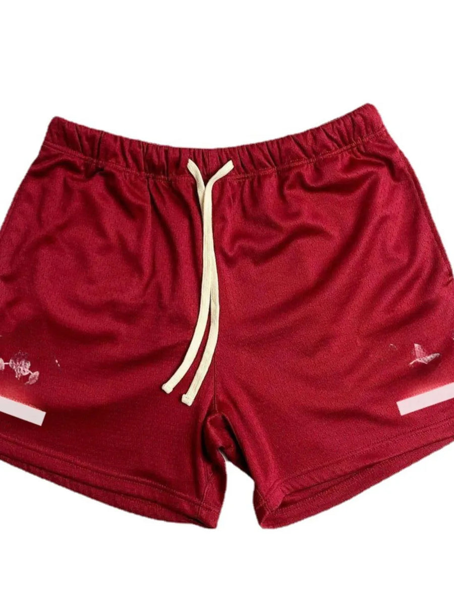 Deep Red mesh sport shorts with white drawstring detail and graphic print