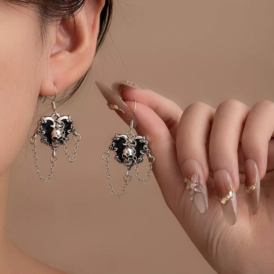 earrings featuring skull motif in silver with Zinc alloy,Stainless Steel,Silver-plated Care instructions: Avoid wearing