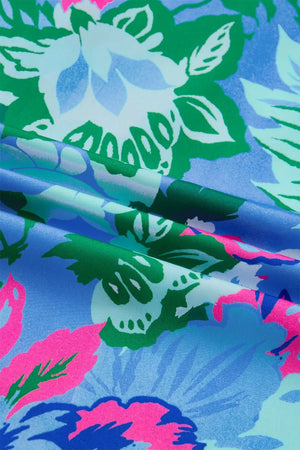 Vibrant floral print blouse with a V-neck and relaxed fit.