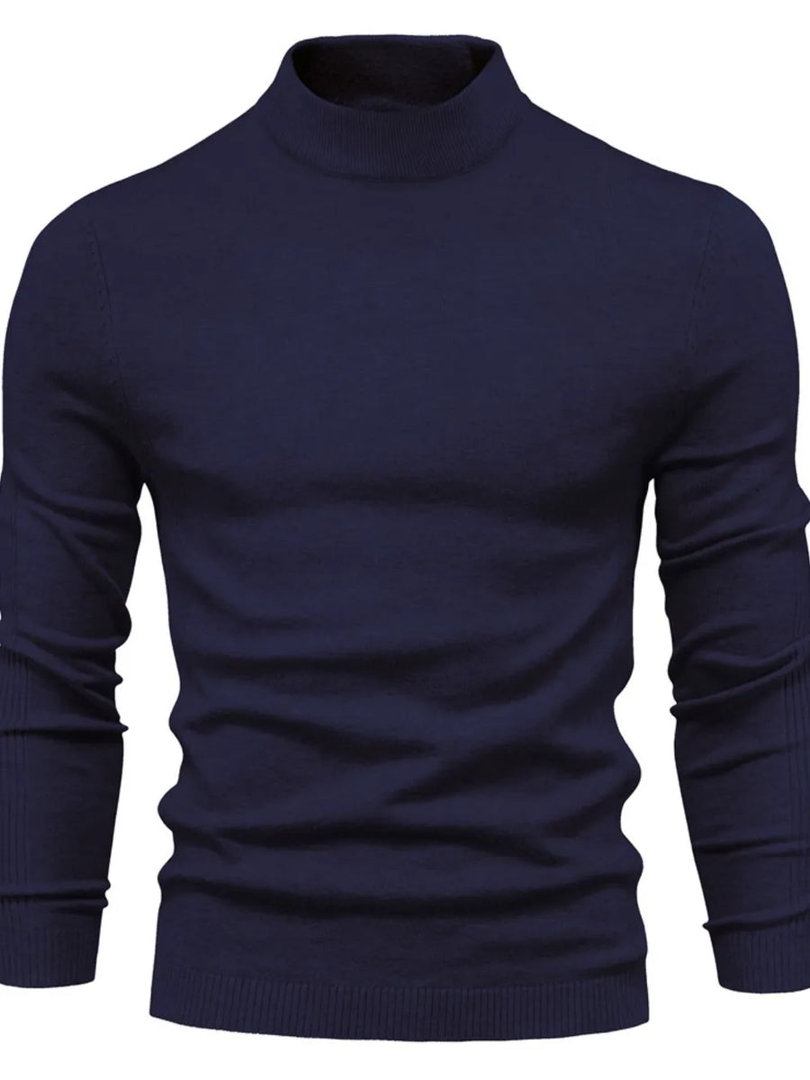 Navy ribbed mock neck sweater with long sleeves and sculpted shoulders.