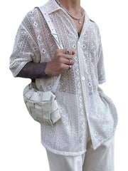 White crochet resort shirt with geometric pattern, button-up style, and short sleeves.