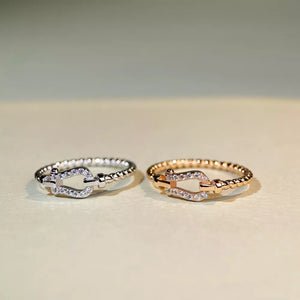 rose gold ring featuring zircon embellishment and beaded