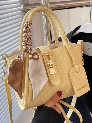 Yellow crossbody bag with scarf detail and gold hardware