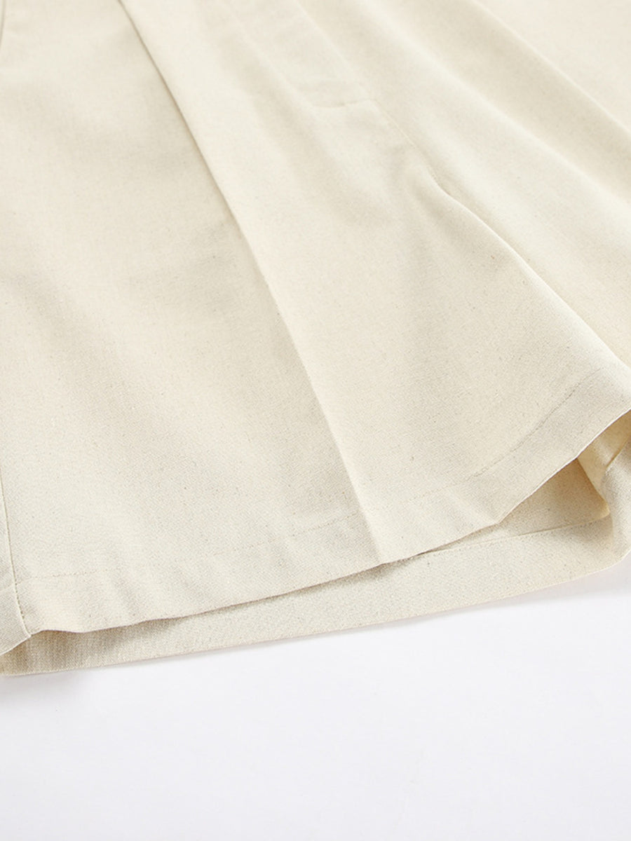 Cream cotton vest and shorts set detail showing fabric texture and pleats.