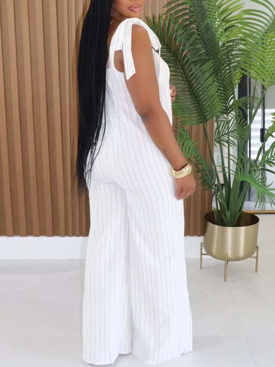White pinstripe wide-leg romper with tie straps and a square neckline.